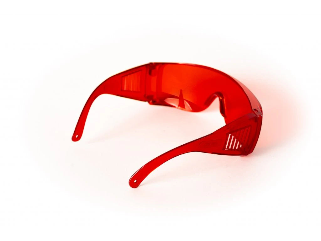 Red glasses against blue and green light