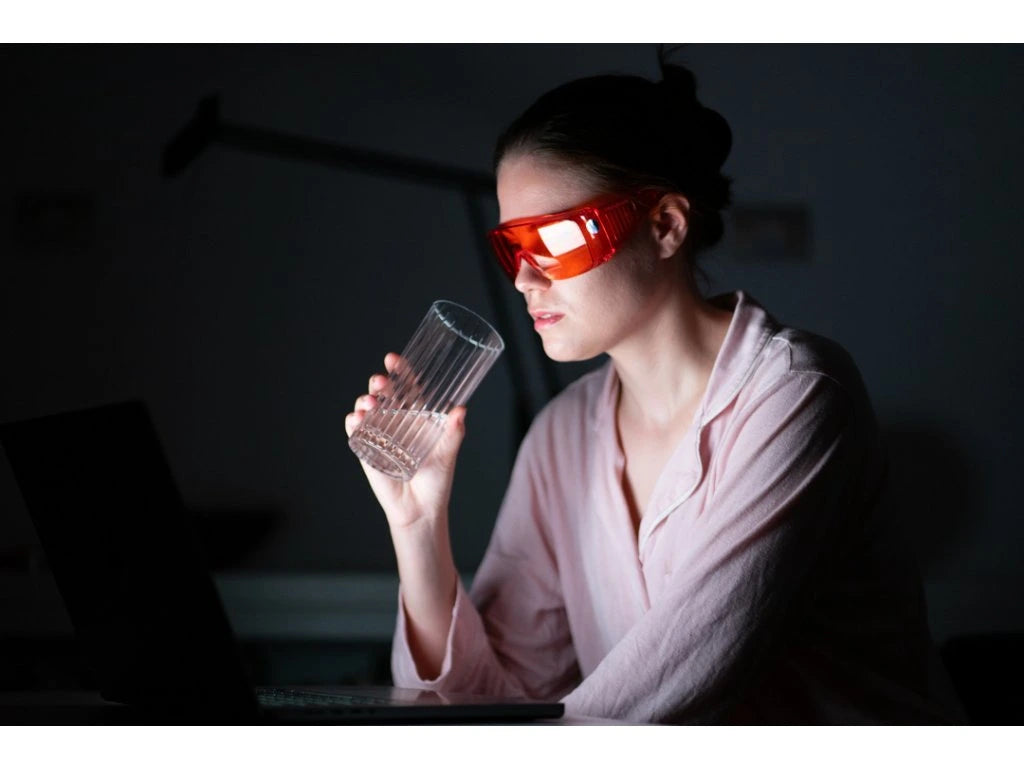 Red glasses against blue and green light